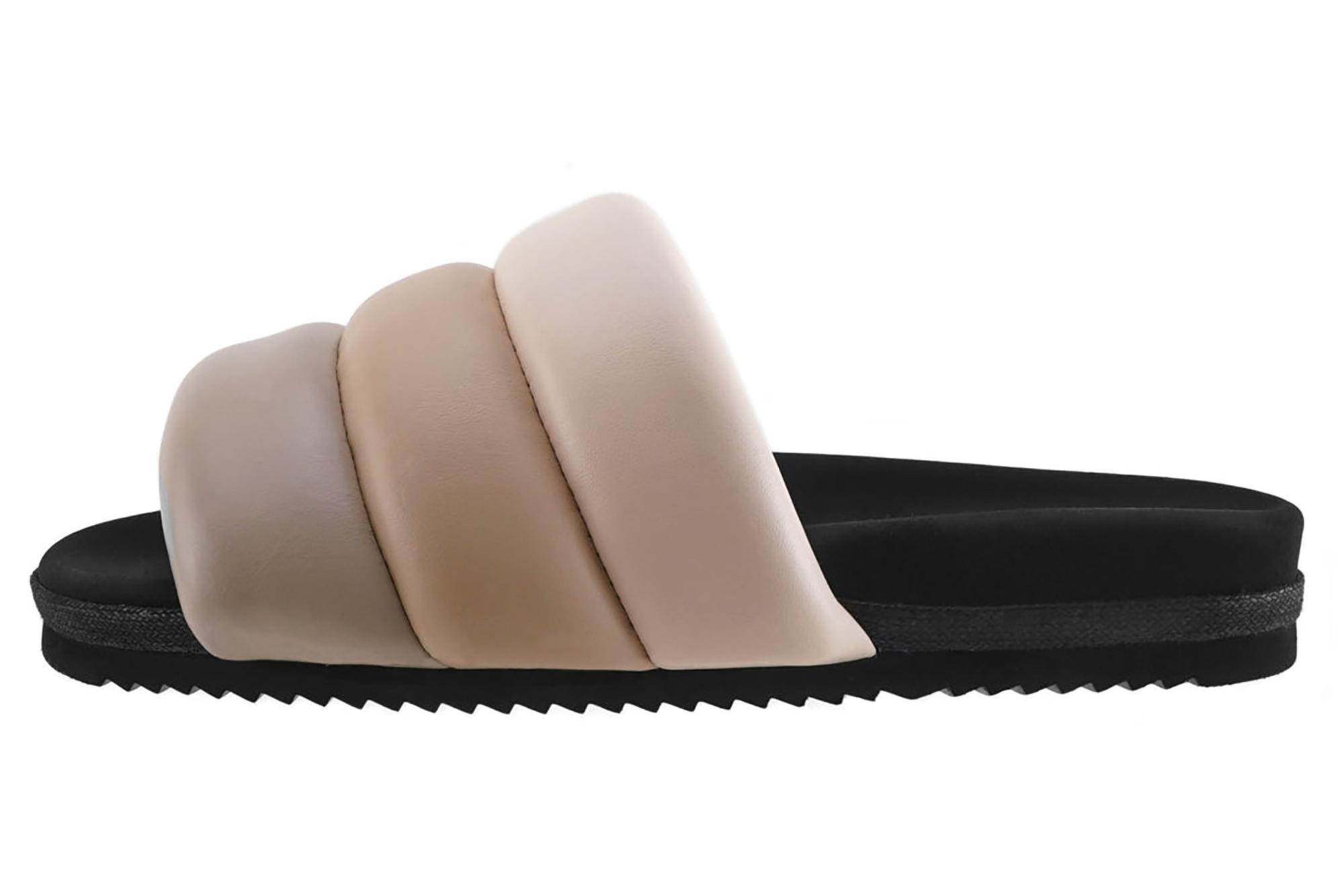 A black sandal with nude slide straps