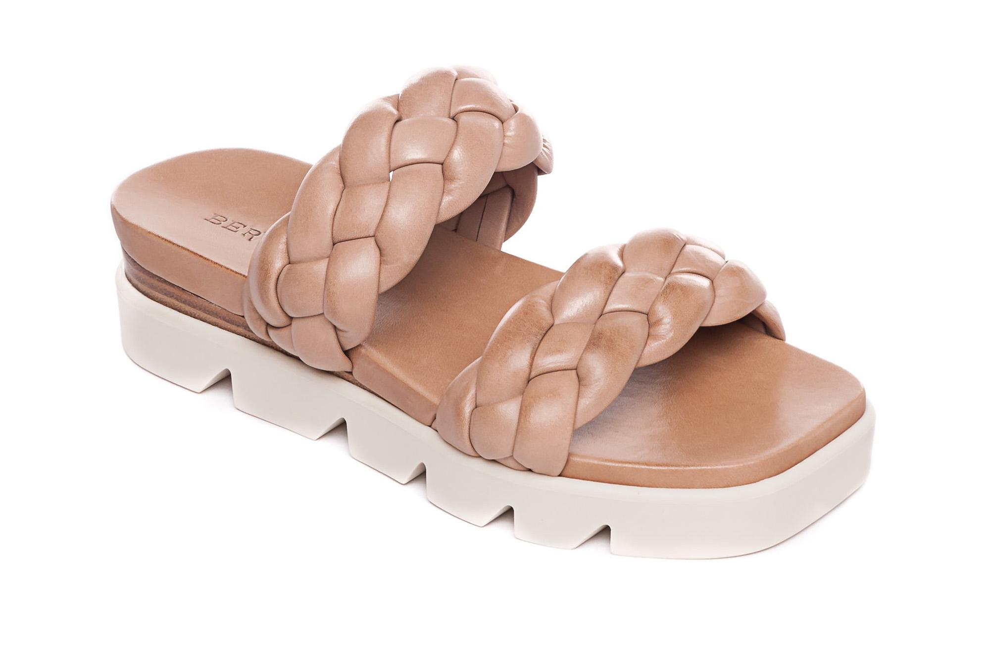 A tan and white leather sandal