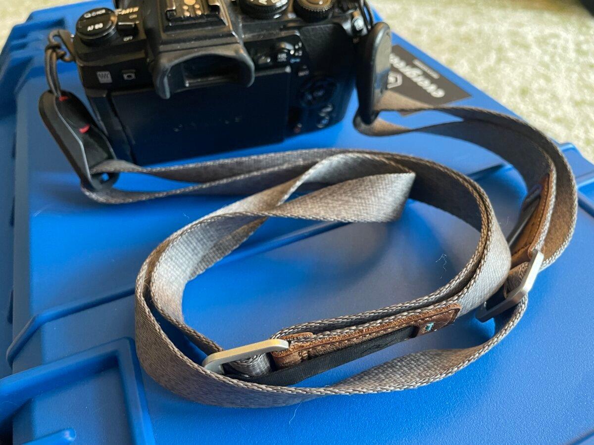 Peak Design leash attached to an Olympus camera body