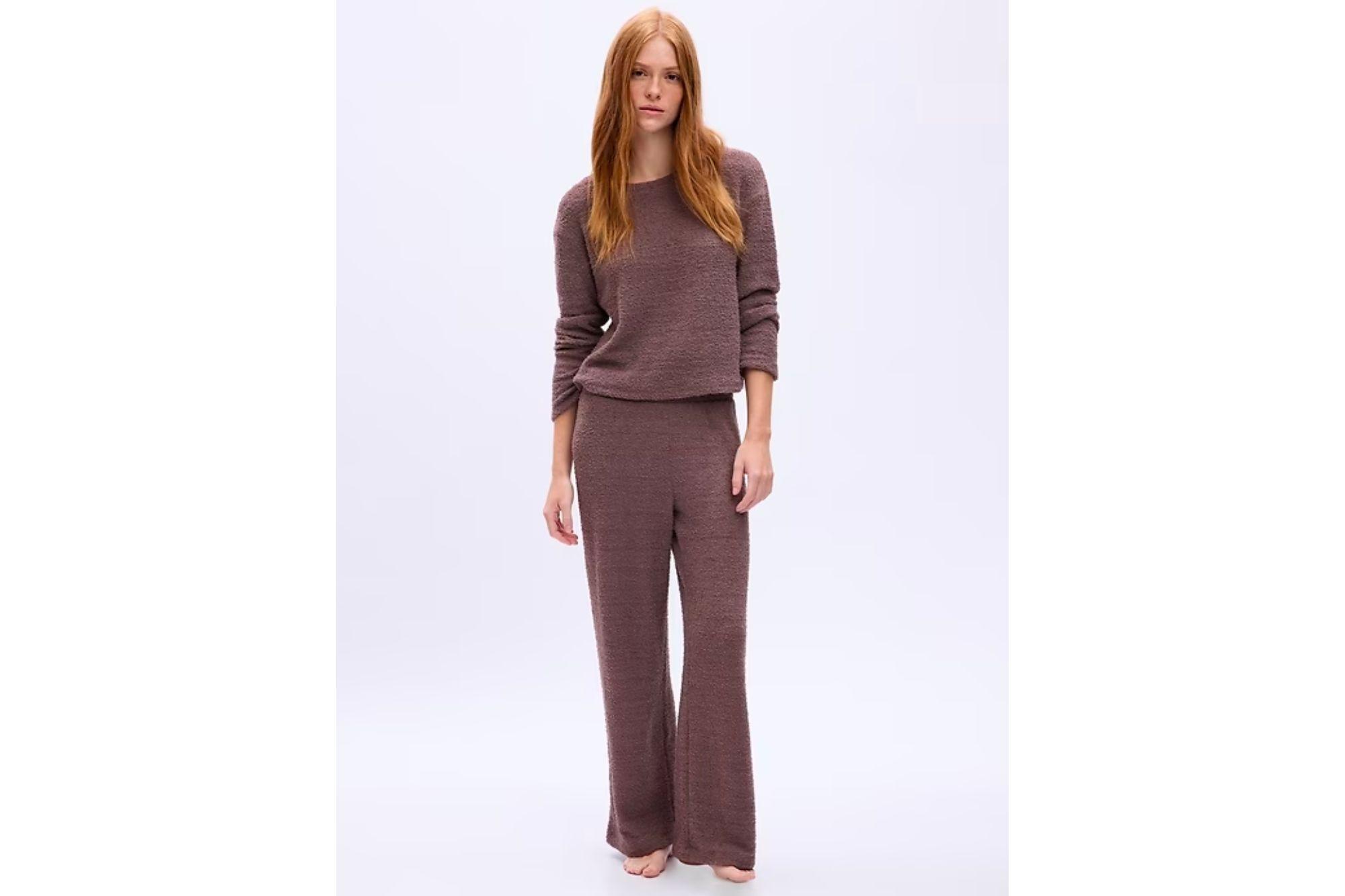 A woman in a pair of brown loungewear.