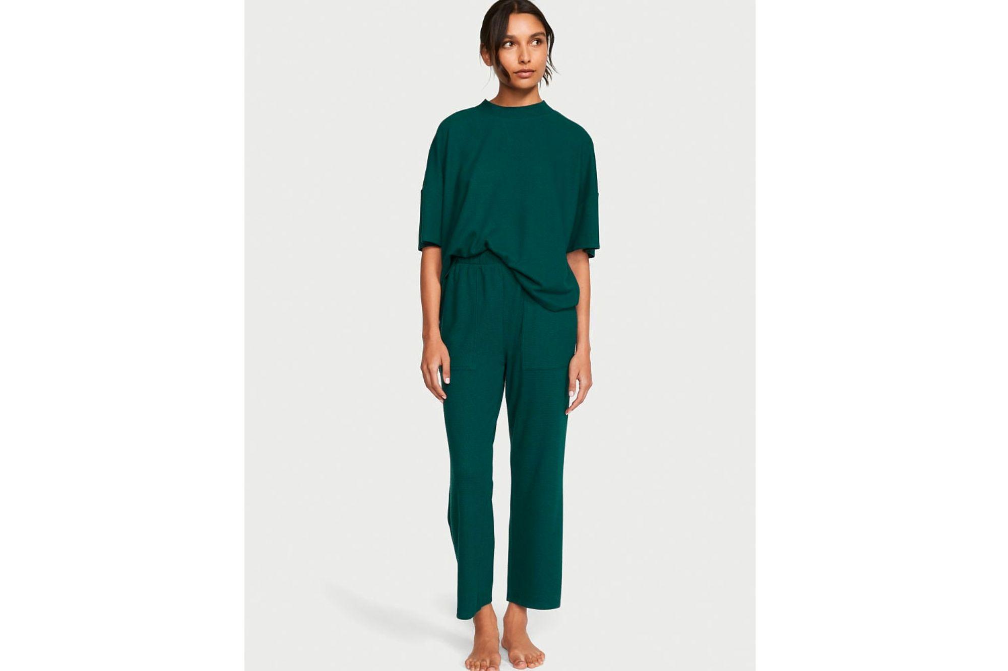 A woman in green loungewear.