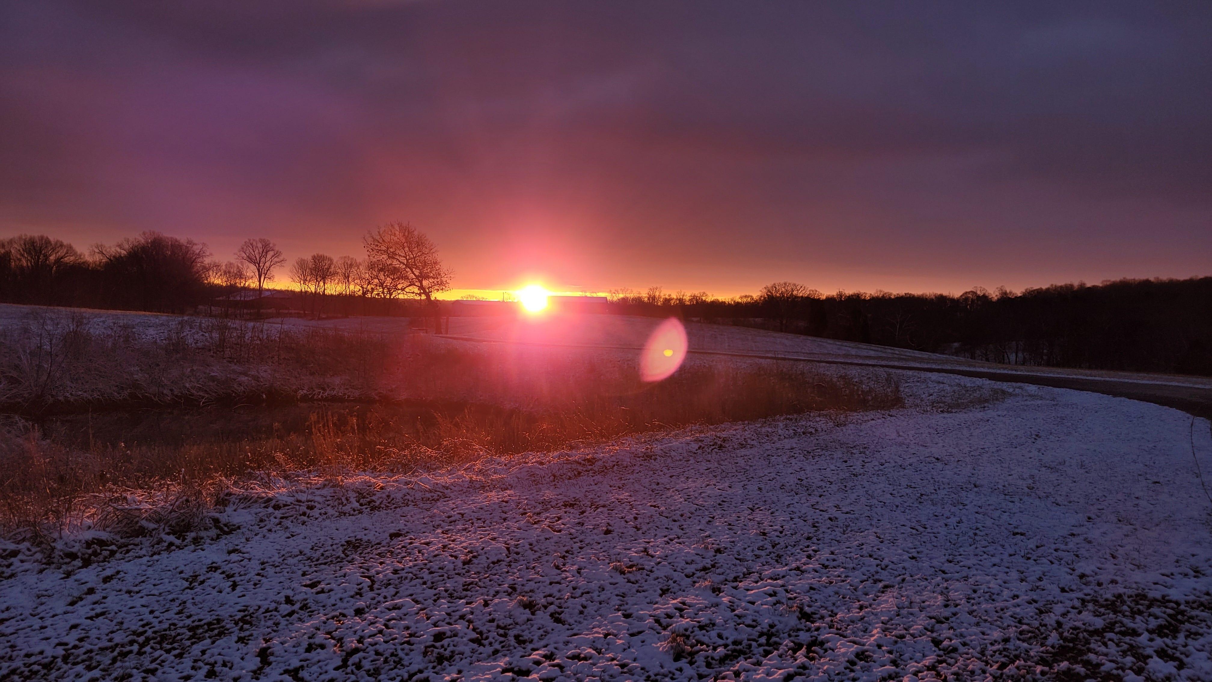 The sun rises to a winter scene with about an inch of snow in Clarksville on Jan. 3, 2022.