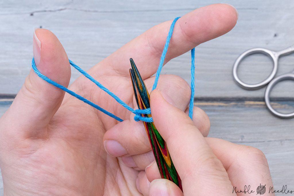 creating another sling shot to continue casting on around two needles