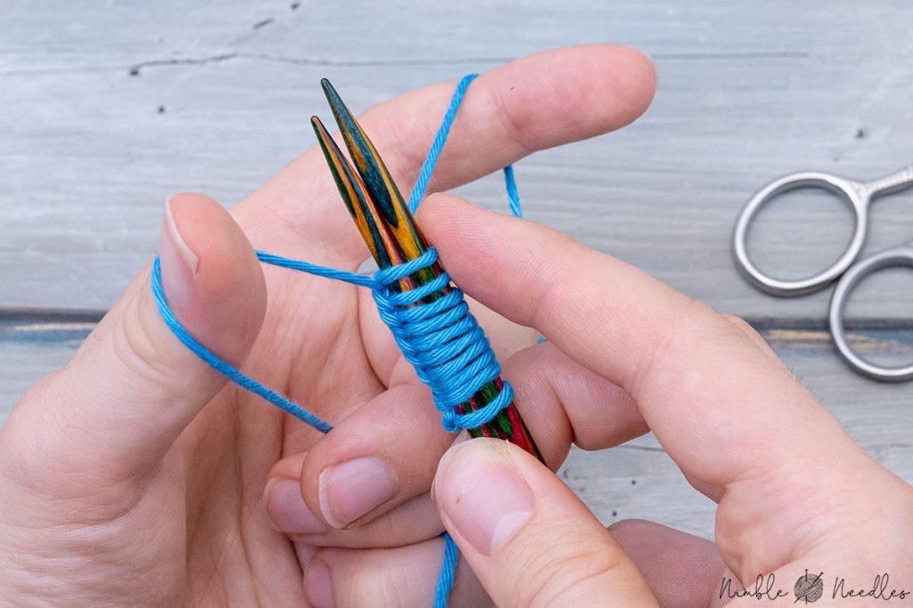 repeating the steps over and over again to cast on stitches with two needles