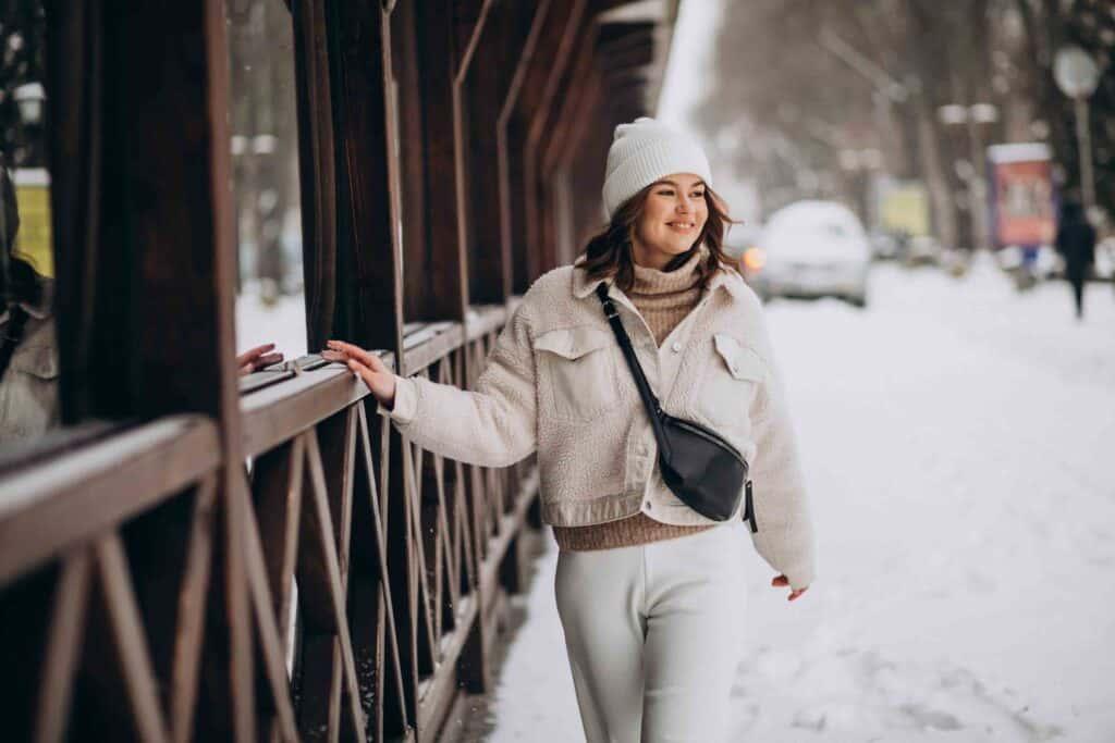 Young woman in winter outfit outside the street