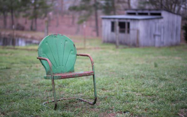 rusted metal lawn chair