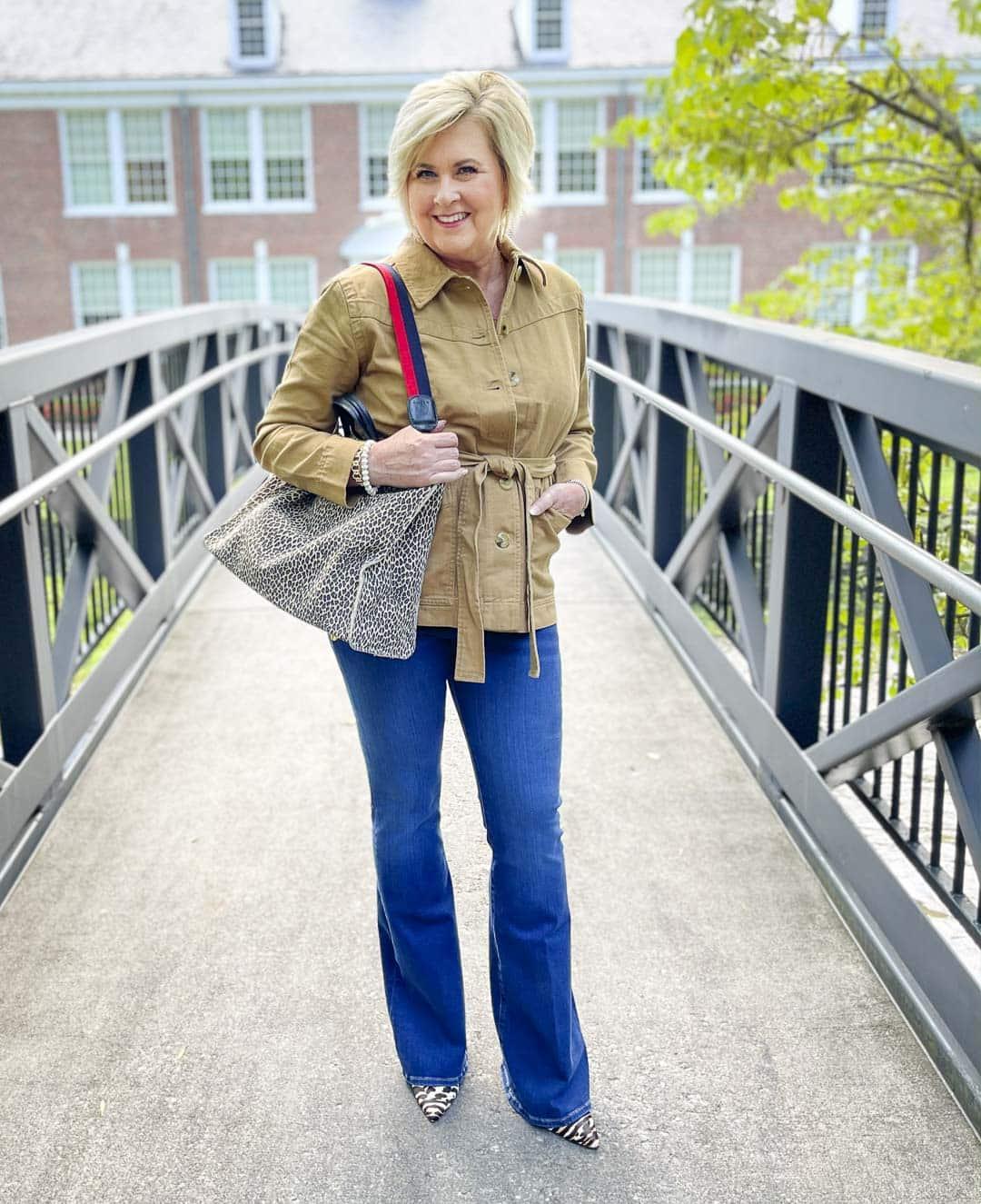 Over 40 Fashion Blogger, Tania Stephens, is wearing a dusty camel jacket with a cream colored sweater