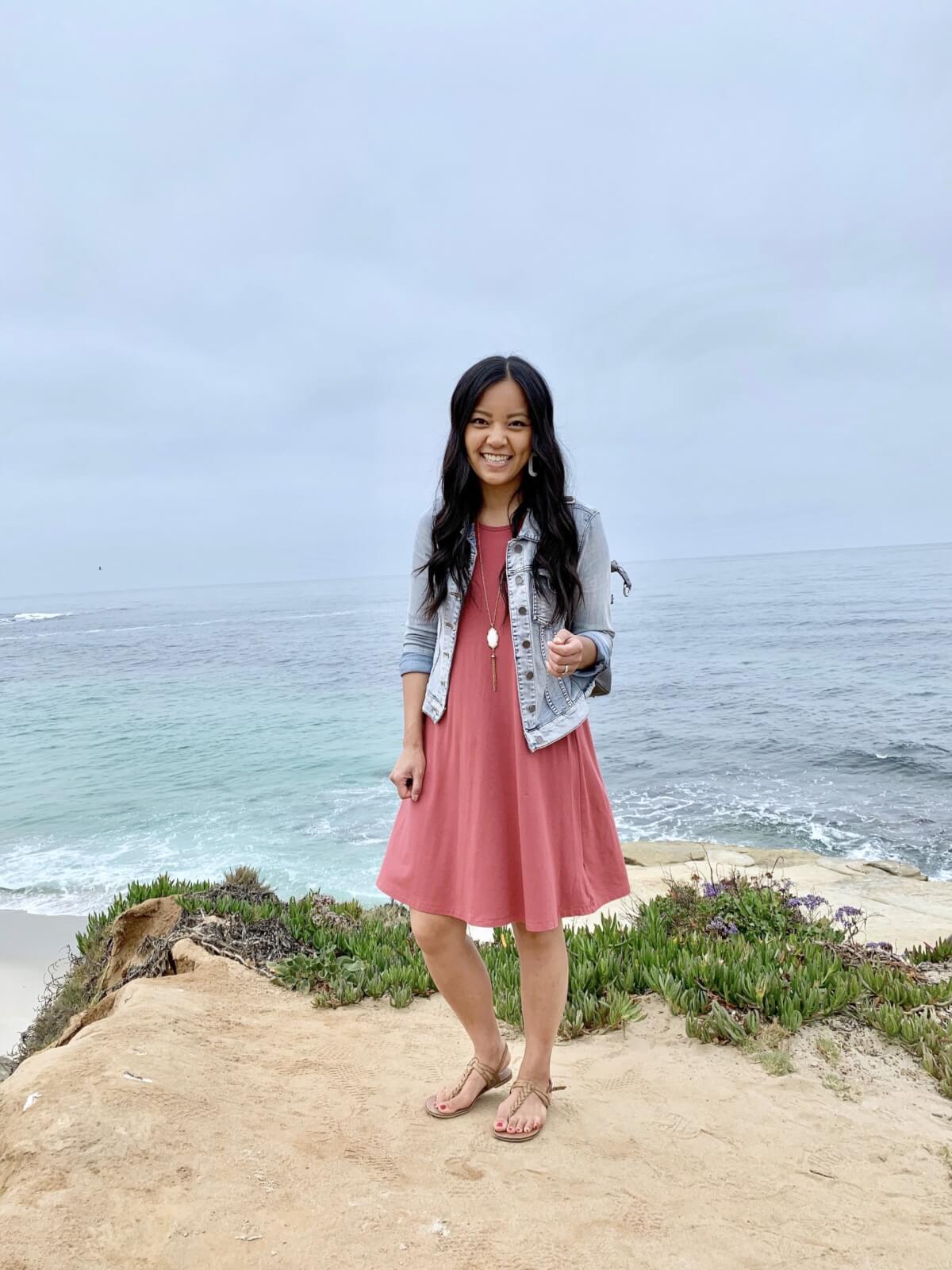 denim jacket outfit: denim jacket + pink dress + nude sandals + pendant necklace