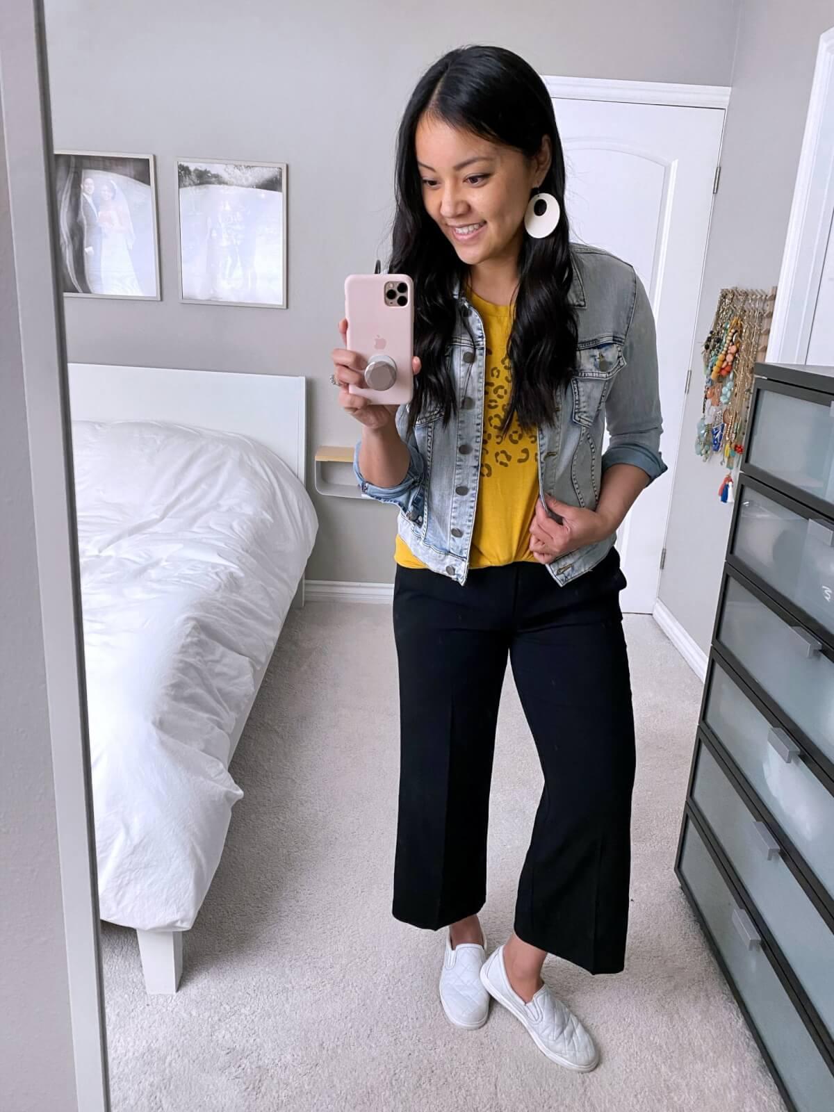 denim jacket outfit: denim jacket + yellow tee + black wide leg pants +white sneakers + white earrings