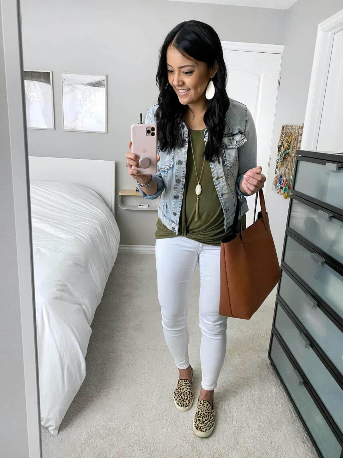 denim jacket outfit: denim jacket + olive tee + white jeans + leopard sneakers + brown tote + pendant necklace + white earrings