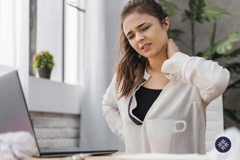 Woman holding her neck in pain