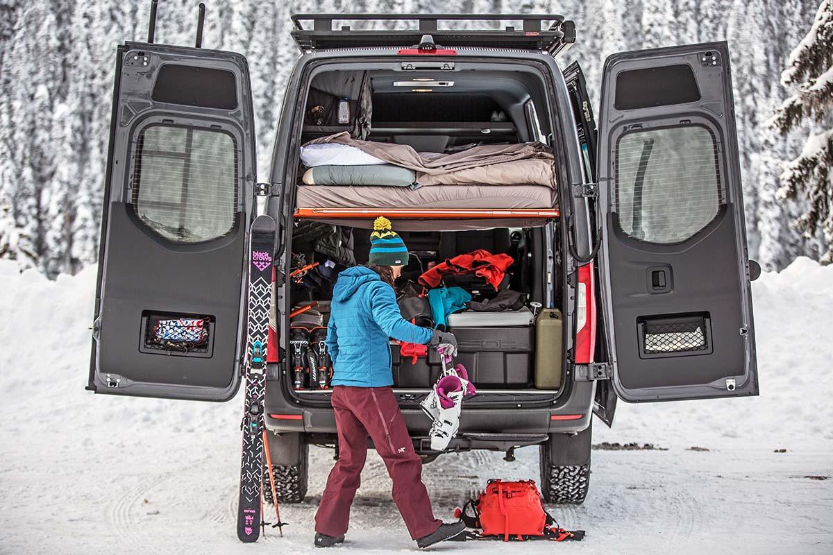 Organizing ski gear at van (women