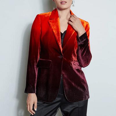 crushed velvet ombre blazer worn with black satin pants; the blazer goes from orange at the top to a dark purple at the bottom