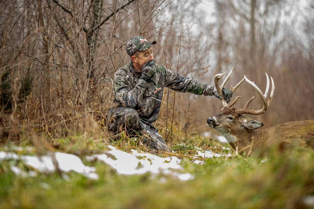 HUNTER WITH BUCK TROPHY