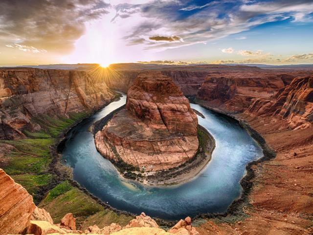 View of Monument Valley on a sunny day near the border of Arizona and Utah in Navajo Nation Reservation in USA.