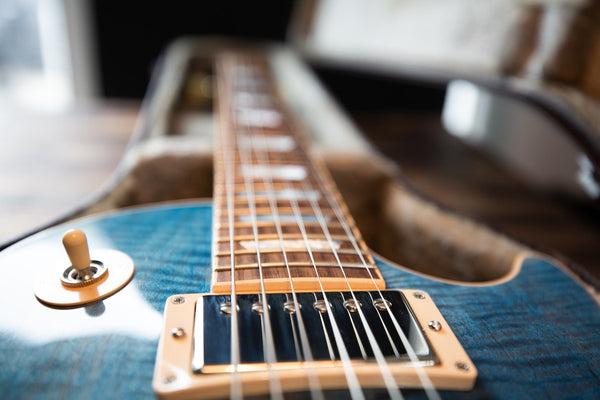 blue gibson les paul guitar with 6 strings