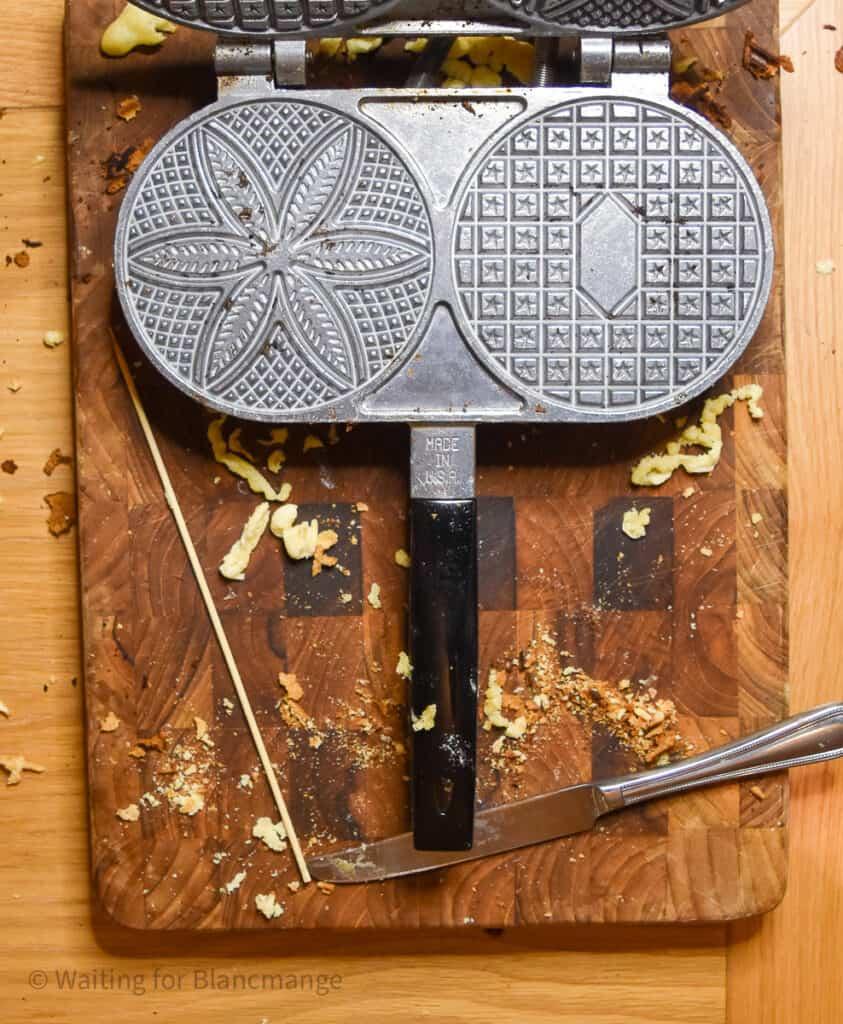 Close up of the bottom of a classic pizzelle thin waffle iron.