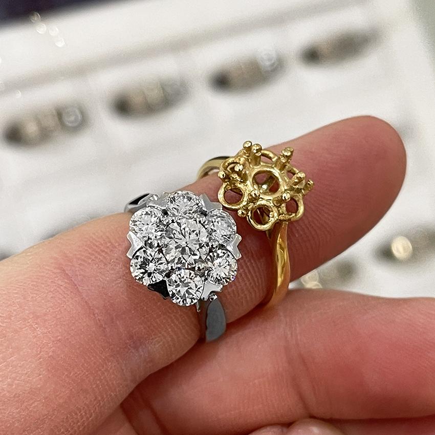 Re-made Platinum cluster ring next to the original yellow gold ring mount.