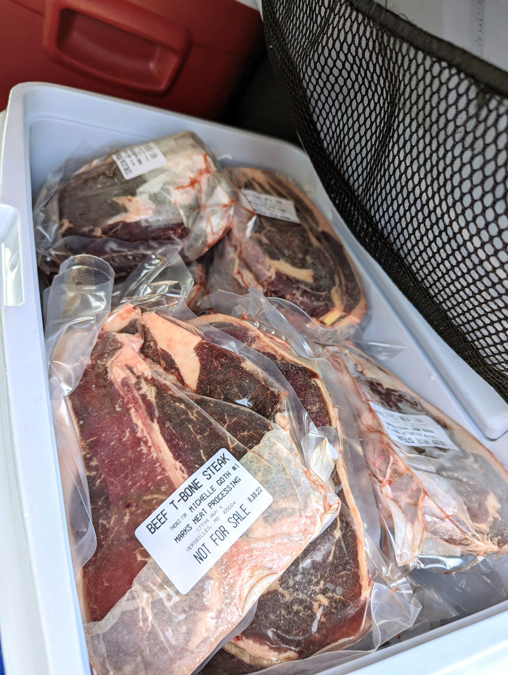 a photo of frozen beef in a cooler