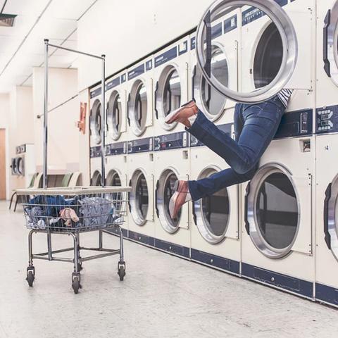 A person stuck in a washing machine because they don