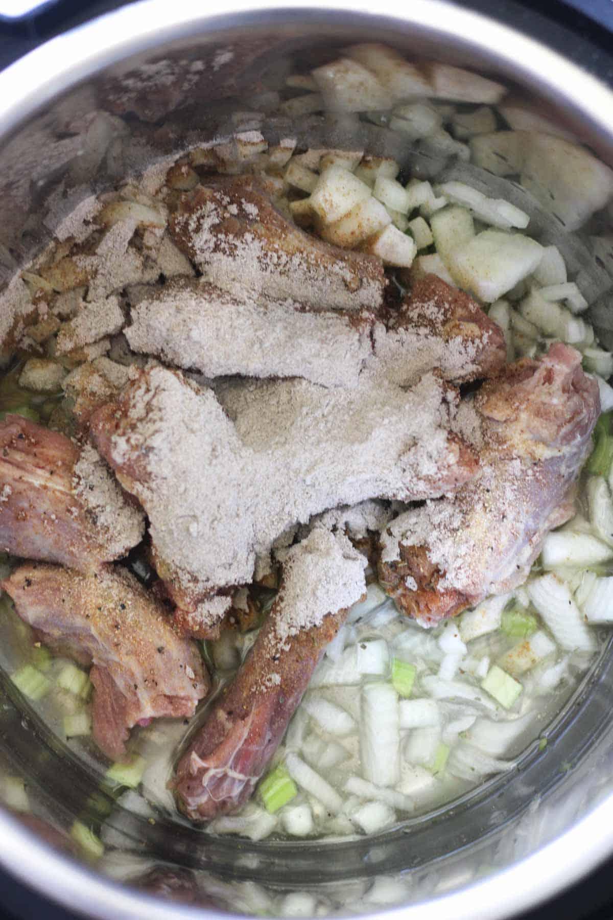 brown gravy on top of poultry in pressure cooker