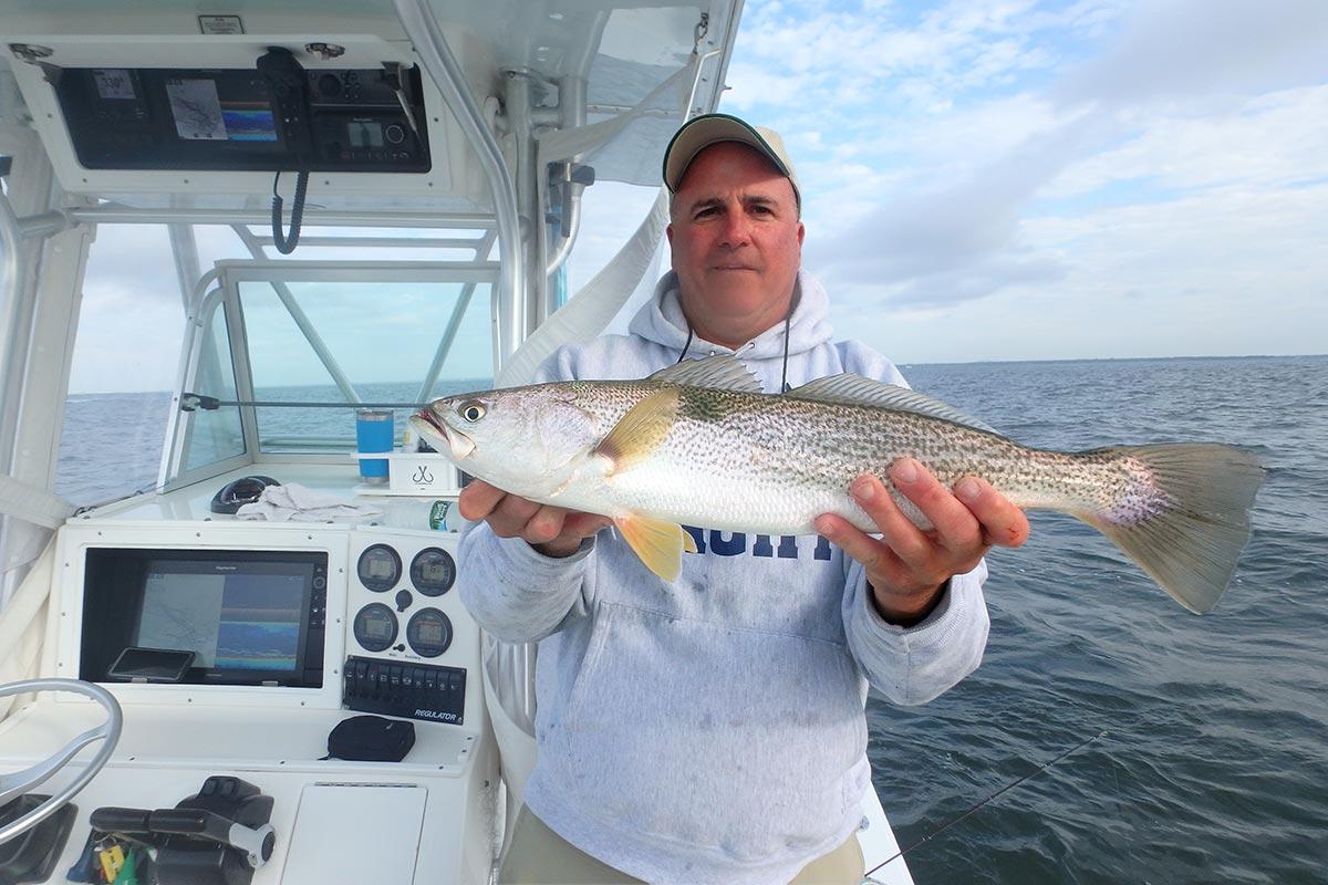 Man showing weakfish