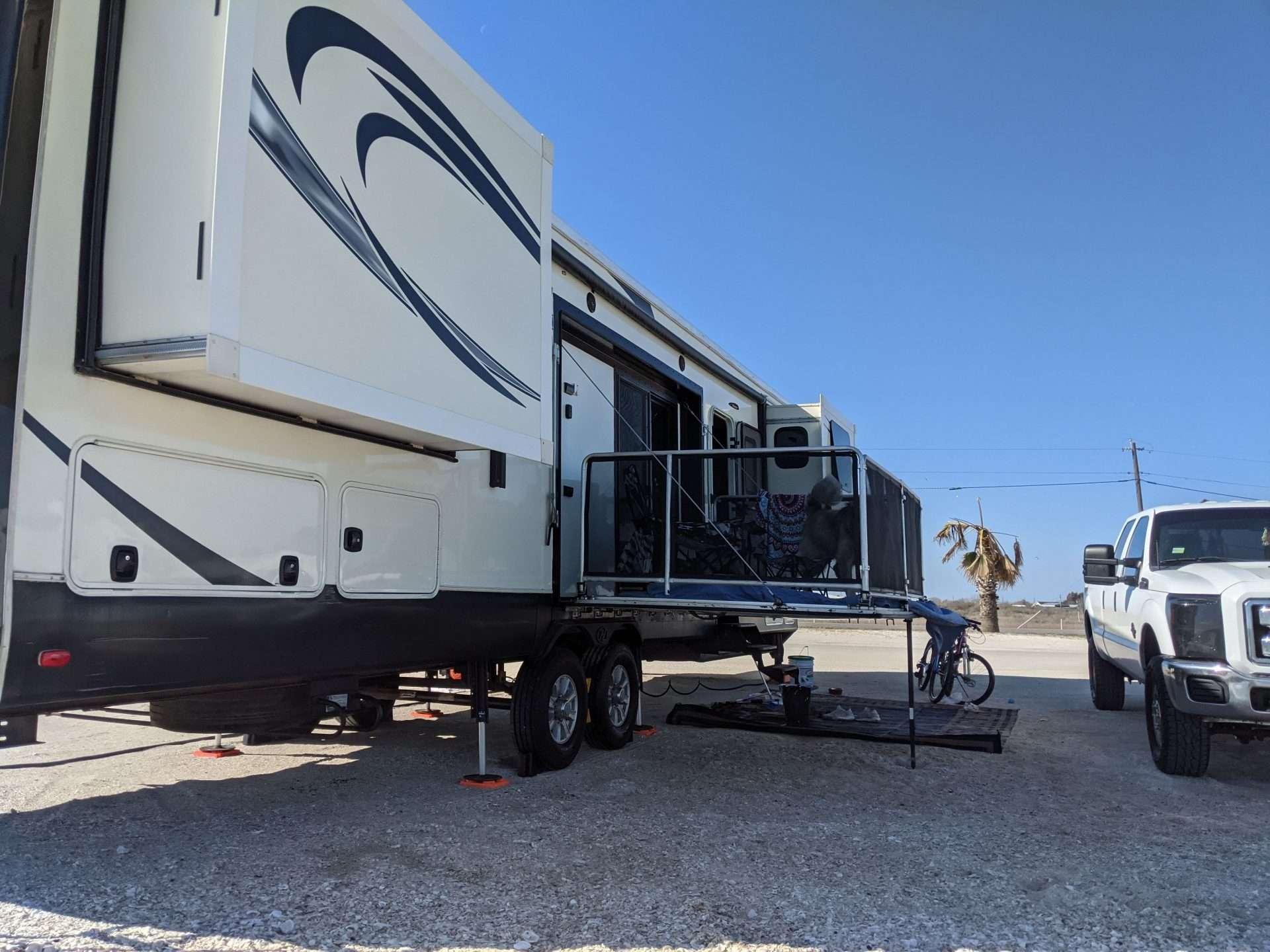 RV wheels on wheel chocks and leveling blocks.