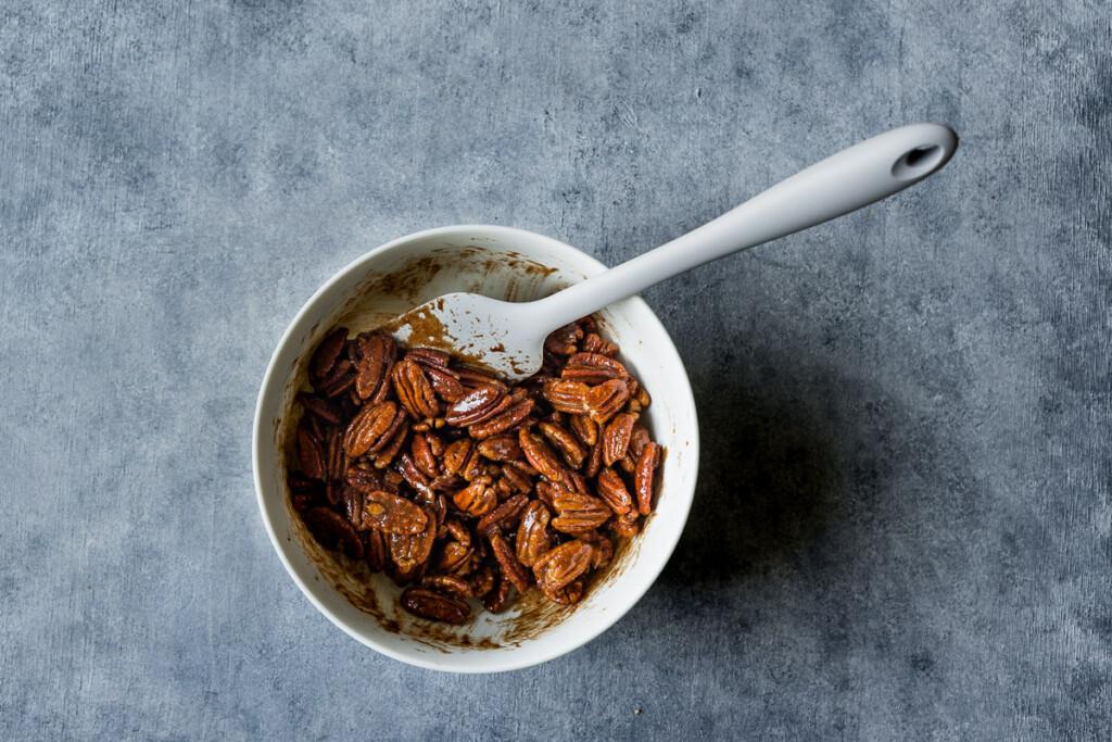 Mixing the nuts and all the other ingredients in a bowl.