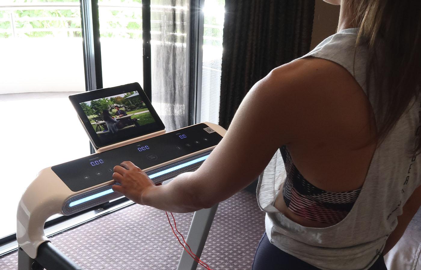 Woman watching a TV series to help keep cardio fun