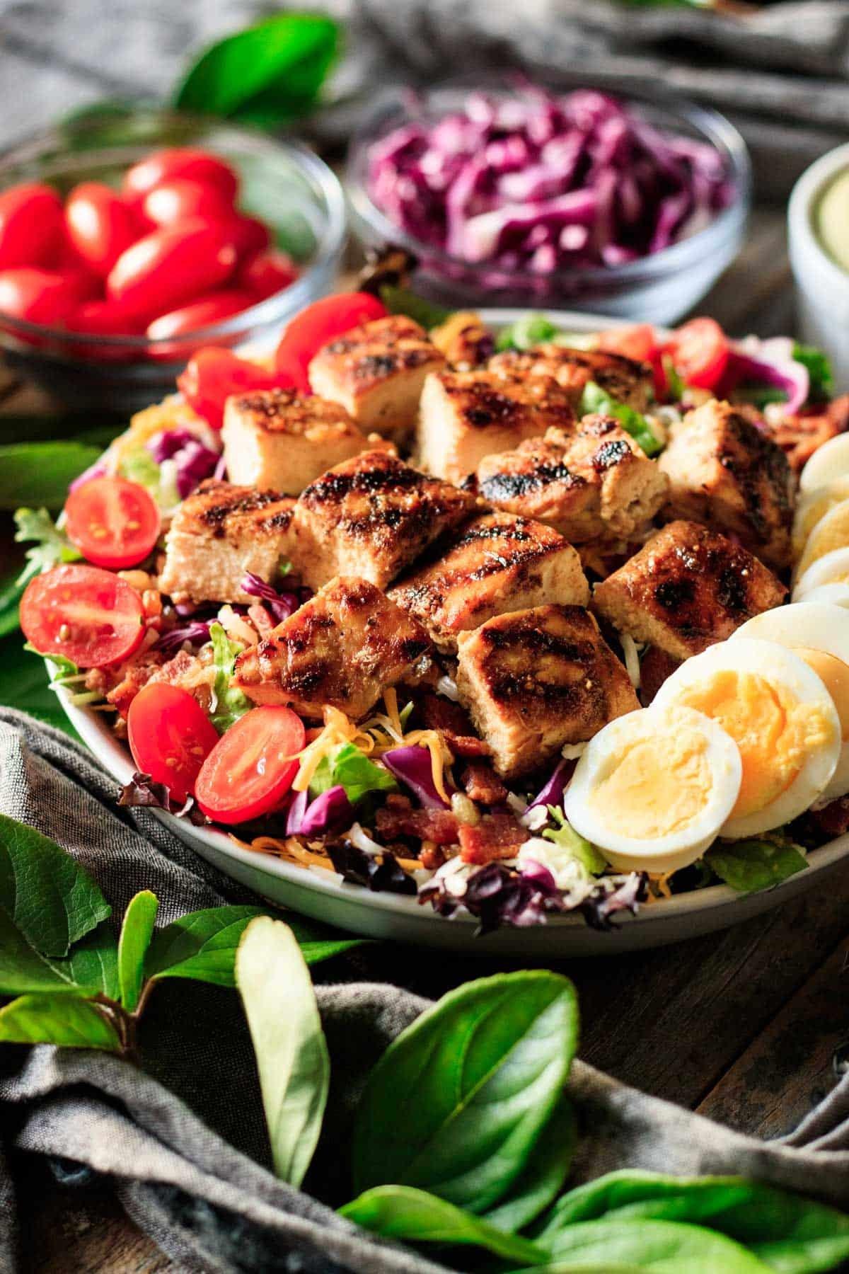 bowl of Chick-fil-A Cobb salad with toppings.