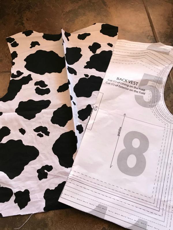 Cut out front part of best using toy story costume pattern twice to make a woody costume vest