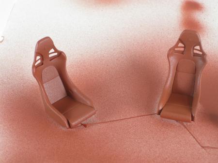 Porsche Carrera model car seats after airbrushing