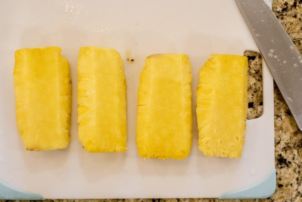 pineapple quarters on cutting board