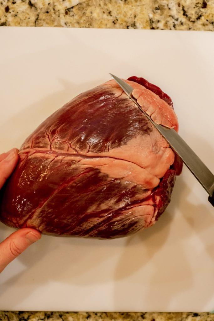 cutting fat off elk heart