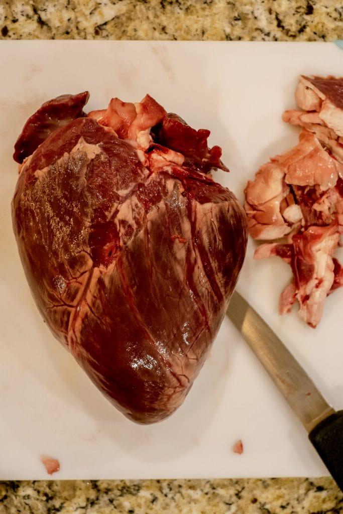 trimmed elk heart on cutting board