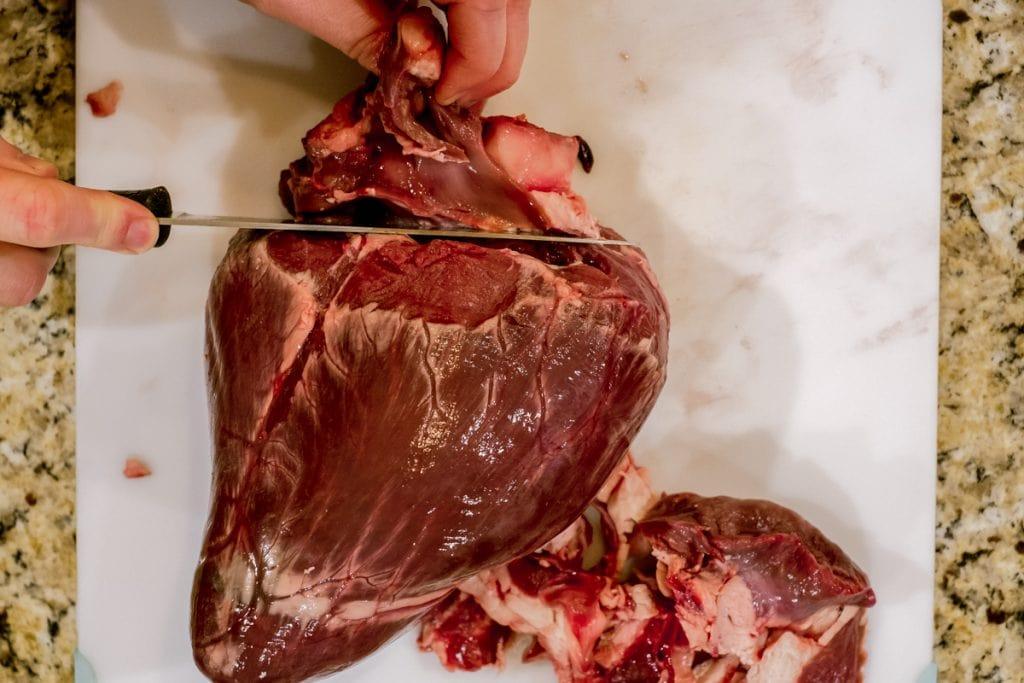 cutting top off of elk heart