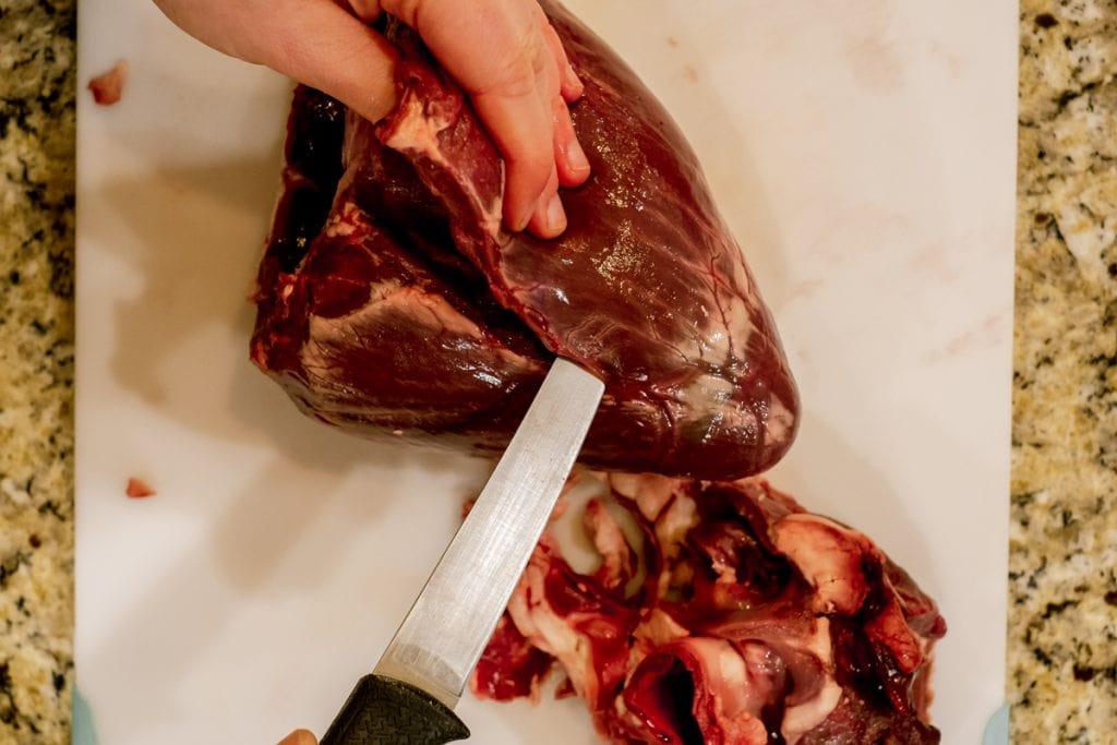 cutting along left ventricle of elk heart