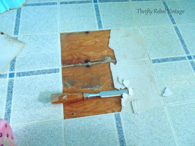 repairing vinyl tile floor by replacing a damaged tile