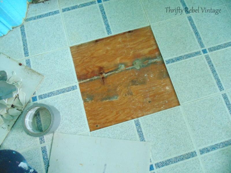 repairing vinyl tile floor by replacing a damaged tile