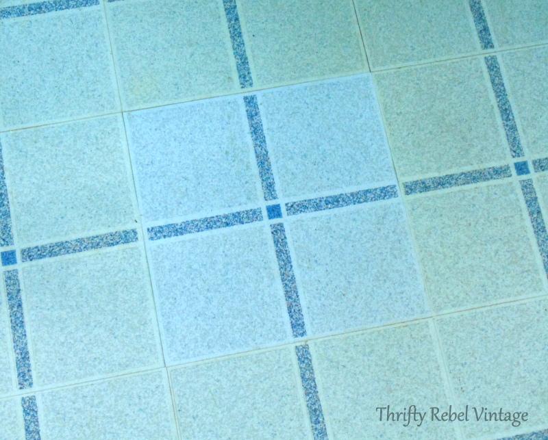 repairing vinyl tile floor by replacing a damaged tile