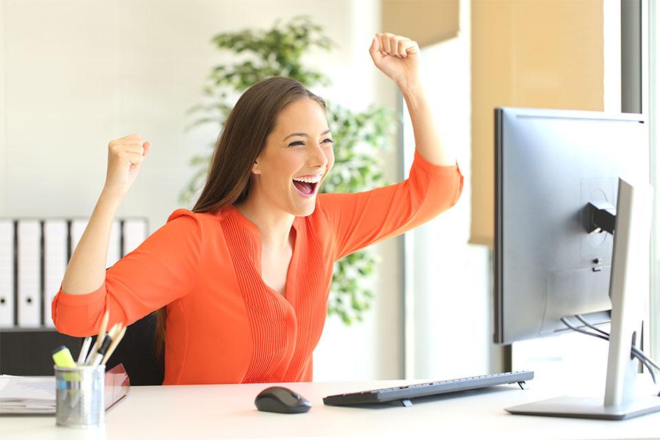 Happy Girl in Front of Computer