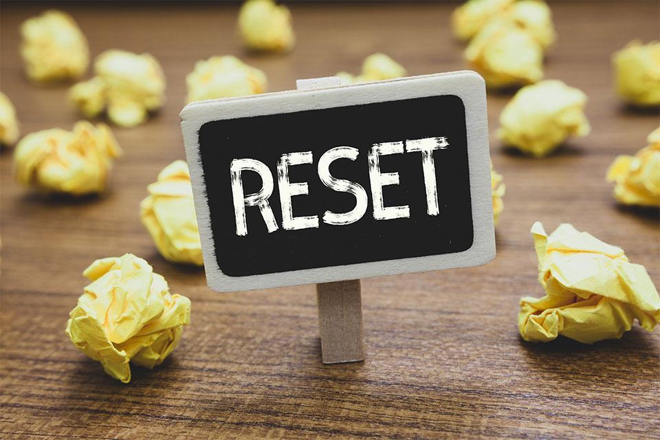 Reset Sign with Crumpled Papers