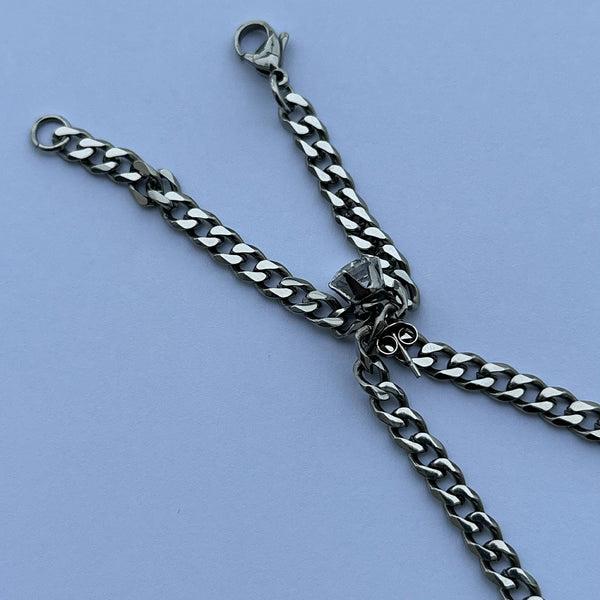 earring being used to shorten chain necklace