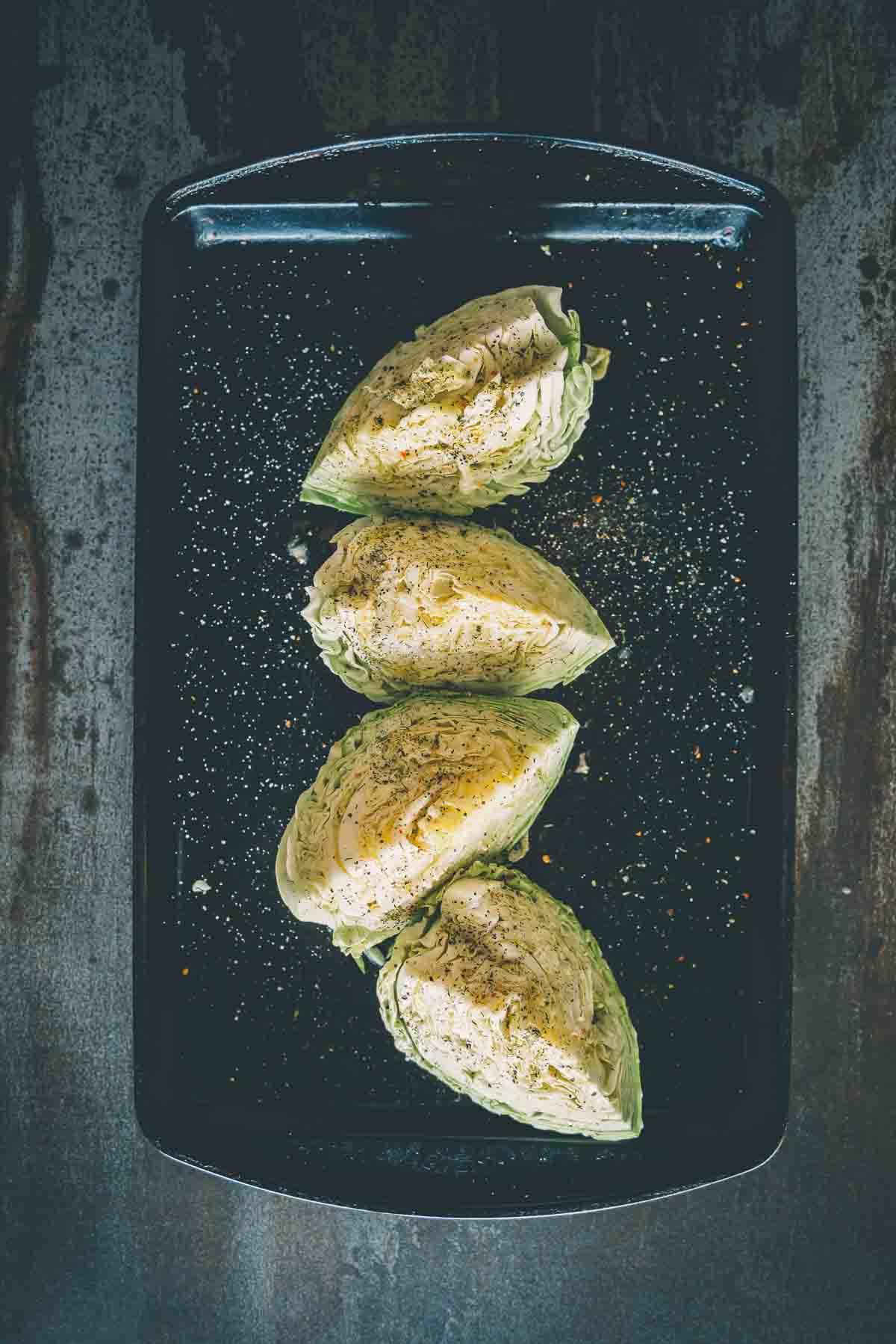 Above shot of cabbage wedges, core removed and seasoned.