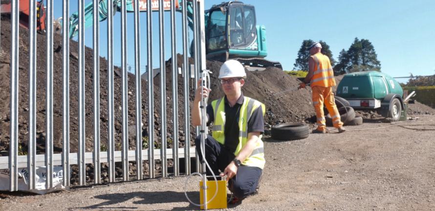 Consultant setting up an asbestos air test at a building site