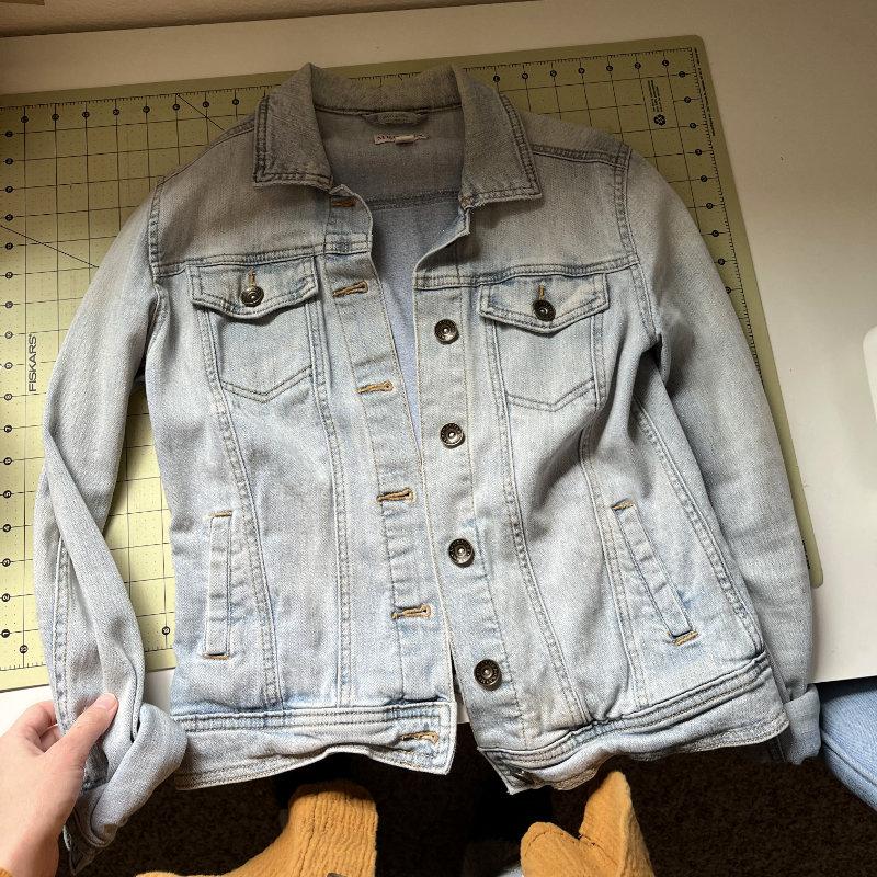 showing denim jacket before