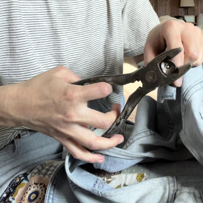 showing the denim vest styled with corduroy pants