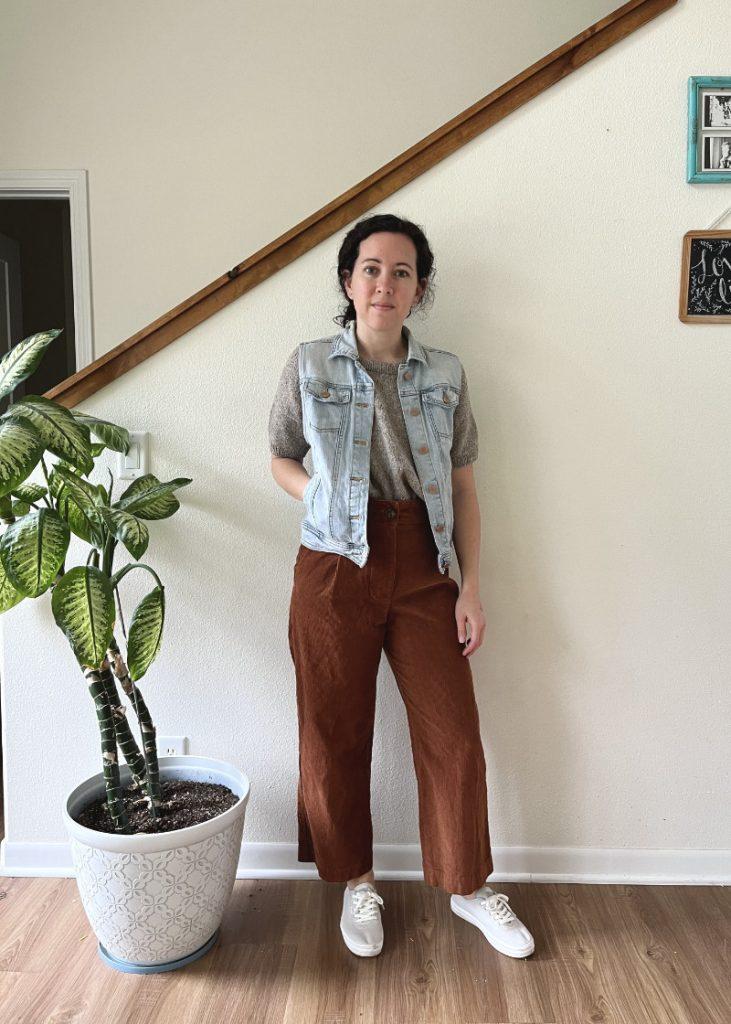 denim vest styled with top and jeans