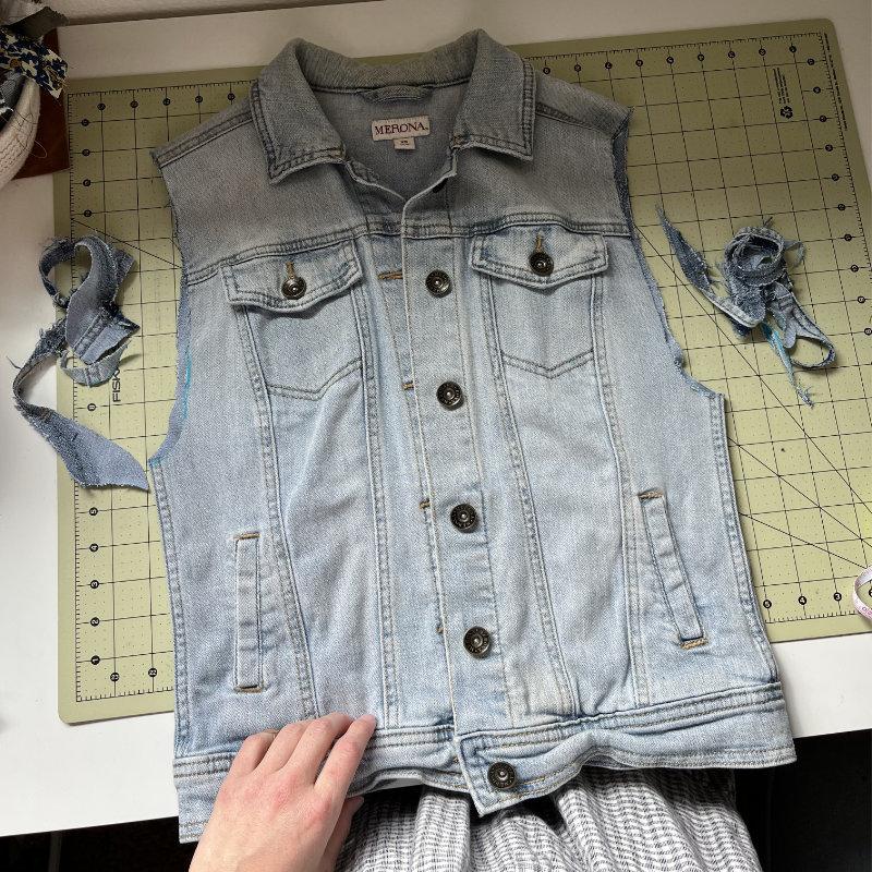 showing the new armholes on the denim jacket