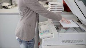 Load Original Documents Into Photocopy Machine for Copying